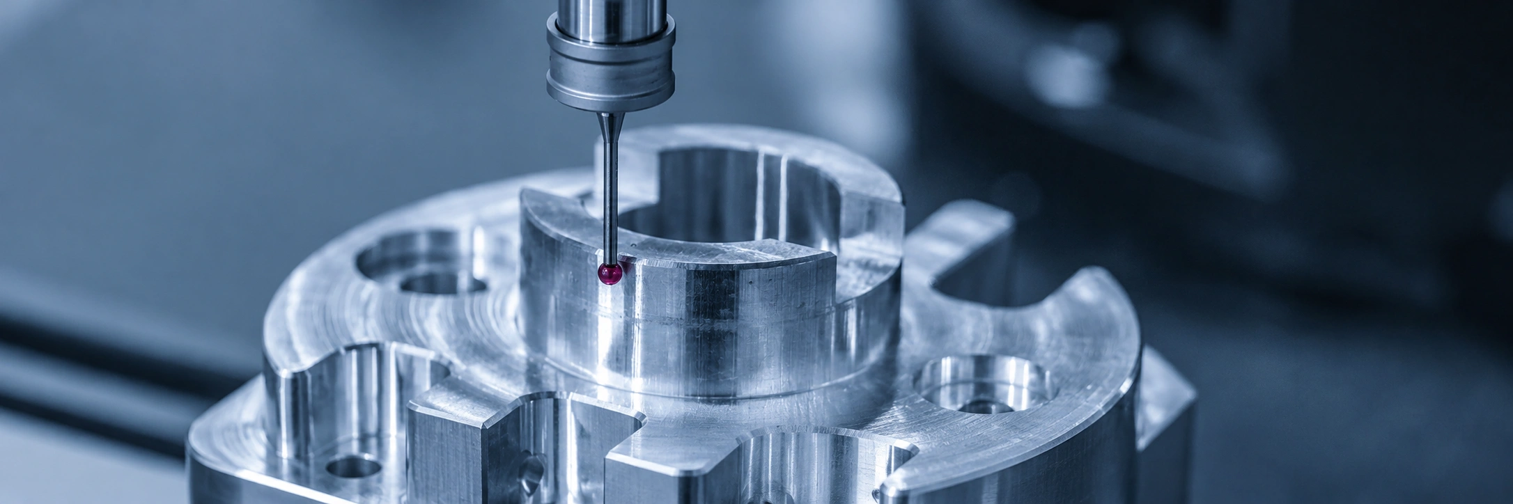 CMM inspection probe measuring a precision-machined metal component for dimensional accuracy and manufacturing quality control.